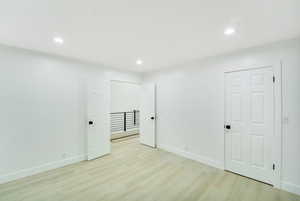 Unfurnished bedroom featuring recessed lighting, baseboards, and light wood finished floors