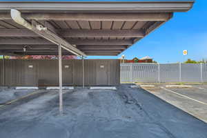 Covered parking lot with fence