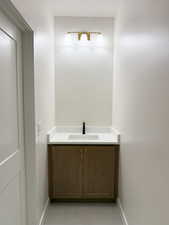 Bathroom with baseboards and vanity