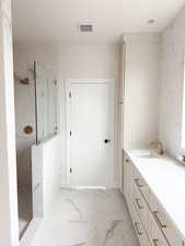 Bathroom featuring visible vents, marble finish floor, vanity, and a marble finish shower