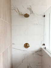 Full bathroom with tiled shower