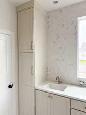 Bathroom with backsplash and vanity