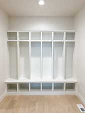 Mudroom featuring visible vents, wood finished floors, baseboards, and recessed lighting