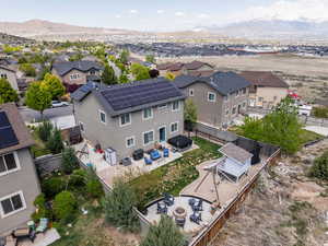 Drone / aerial view with a residential view and a mountain view