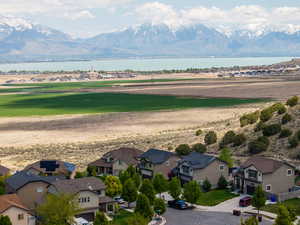 Drone / aerial view with a residential view and a water and mountain view