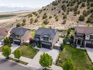 Birds eye view of property with a residential view and a mountain view