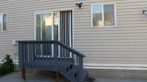 Entrance to property with a wooden deck