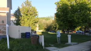 Surrounding community featuring a lawn and fence