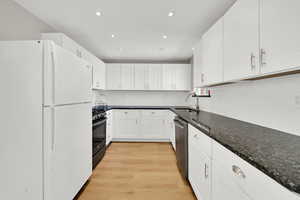 Kitchen with recessed lighting, range with gas stovetop and oven