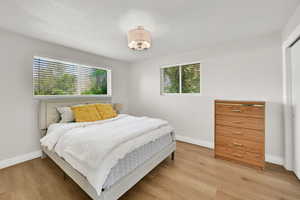 Second Bedroom upstairs featuring light wood-style floors