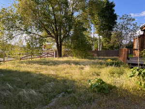 View of yard featuring fence