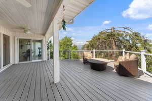 Wooden deck with a ceiling fan