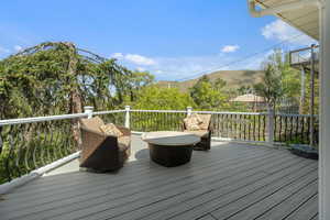 Wooden deck featuring a mountain view