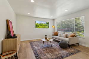 Living room featuring recessed lighting, a healthy amount of sunlight, and light wood vinyl floors