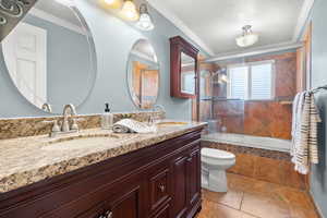 Bathroom featuring  tile floors, and tiled shower / bath combo