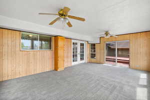 Sun  room with a ceiling fan, and french doors,