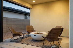 Balcony with a fire pit and a patio area