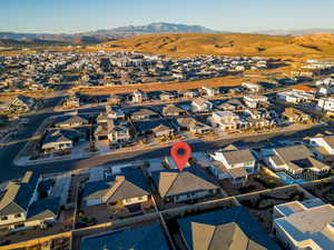 Drone / aerial view with a residential view and a mountain view