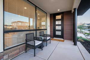Doorway to property with a balcony