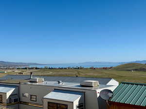 Exterior space featuring a water and mountain view