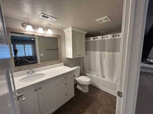 Ensuite bathroom featuring vanity, ensuite bathroom, toilet, and visible vents