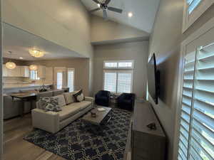 Living room with a ceiling fan, recessed lighting, wood finished floors, and a wealth of natural light