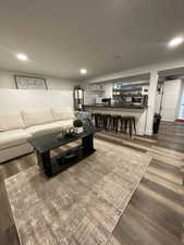 Living room featuring wood finished floors and recessed lighting