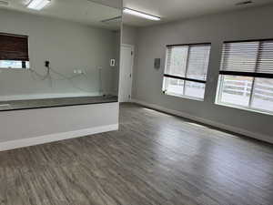 Spare room with wood finished floors and baseboards