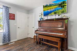 Entryway dark wood finished floors, and baseboards