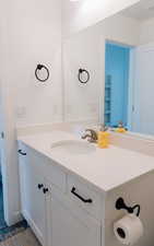 Bathroom with vanity and visible vents