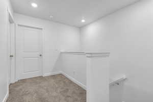 Spacious closet with carpet