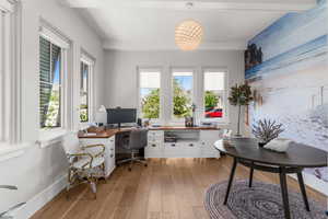 Office featuring baseboards, plenty of natural light, light wood-style flooring, and built in study area