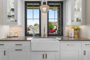Bar with a sink and decorative backsplash