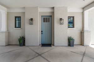 Property entrance with stucco siding