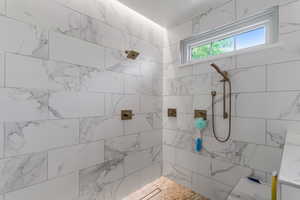 Bathroom with tiled shower