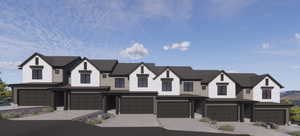 Townhome / multi-family property with a garage