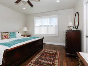 Primary Bedroom featuring baseboards, recessed lighting, ceiling fan, and dark wood-style floors