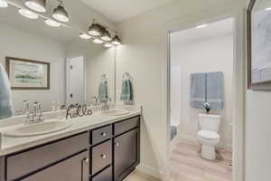 Hall Bathroom with double vanity, linen closet, and seperate tub/toilet room.
