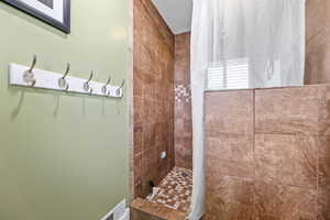 Tile shower in Primary Bathroom
