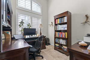 Office space with light colored carpet