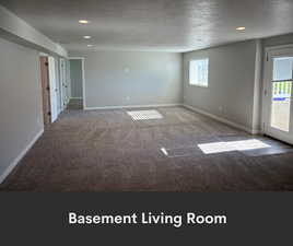 Empty room with carpet flooring, a textured ceiling, baseboards, and recessed lighting