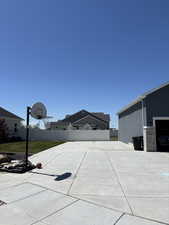 View of patio featuring basketball hoop