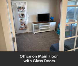 Bedroom with carpet floors and baseboards
