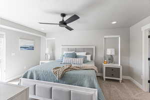 Carpeted bedroom featuring baseboards, ceiling fan, recessed lighting, and a textured ceiling