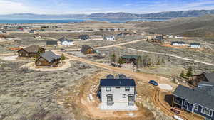 Aerial view featuring a water and mountain view