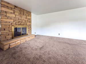Living room with stone fireplace