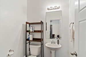Half bath featuring toilet