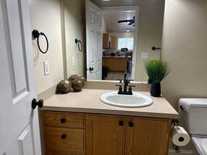 Bathroom featuring vanity and toilet