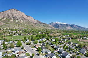 Birds eye view of property featuring a mountain view and a residential view
