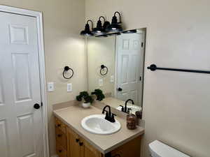 Bathroom featuring vanity and toilet